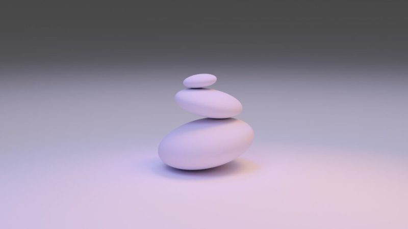 white round stone on white surface