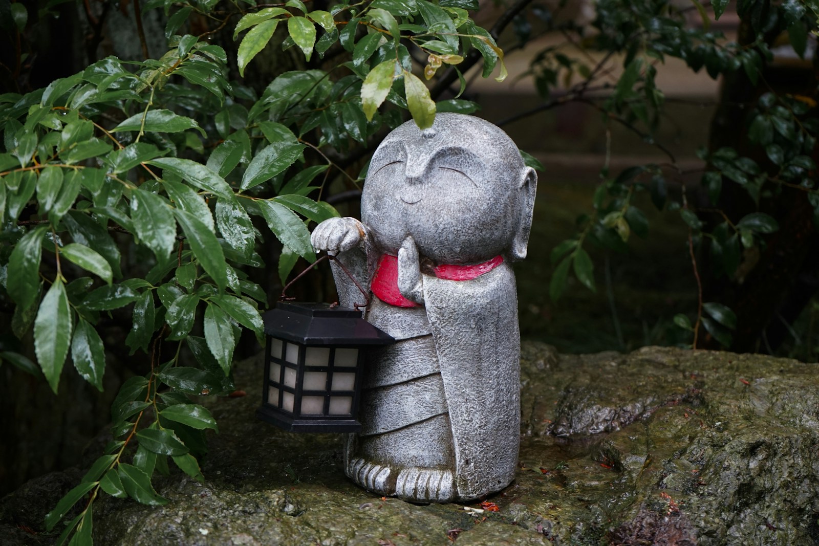 A statue of an elephant holding a basket